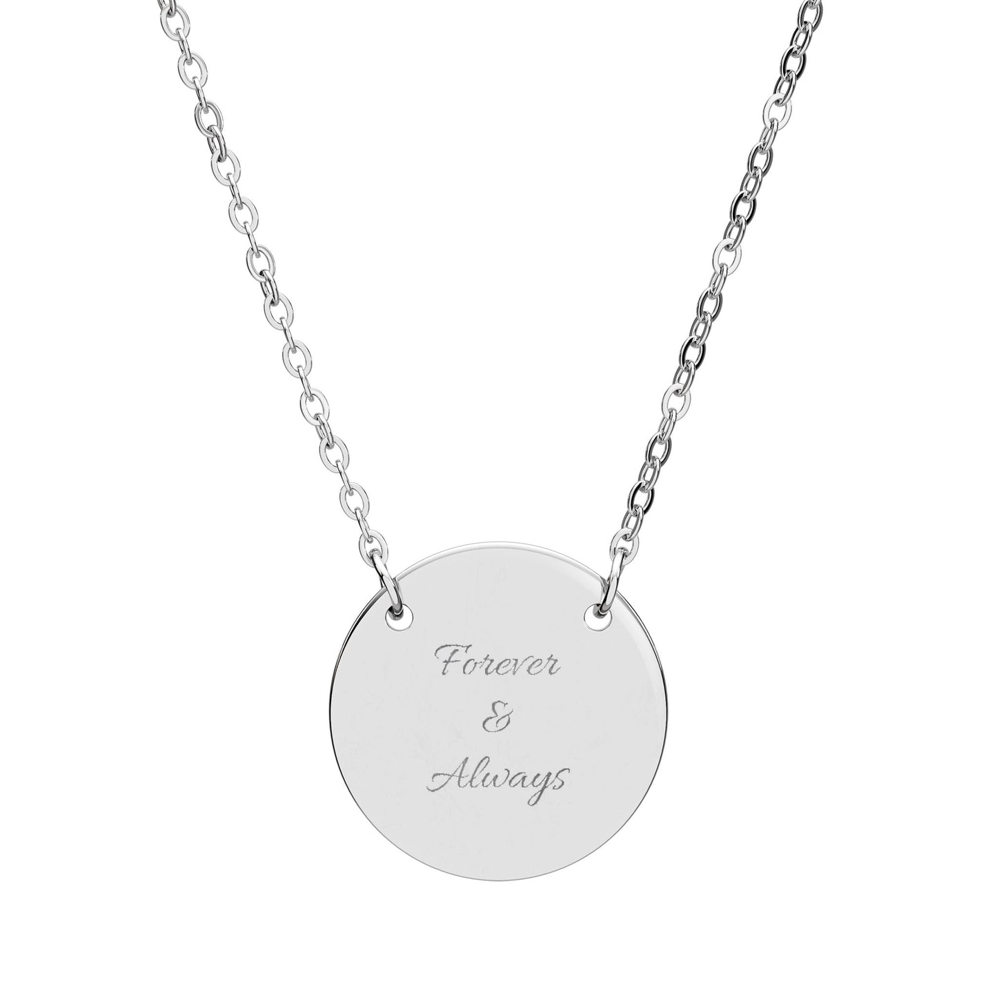 Silver necklace with a round pendant engraved with 'I Wear My Peace like Gold' on a white background