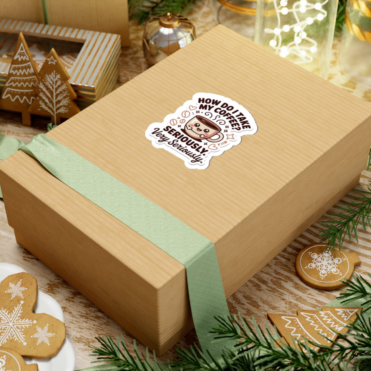 Wooden gift box with a green ribbon and a decorative sticker on a festive background with cookies and lights.