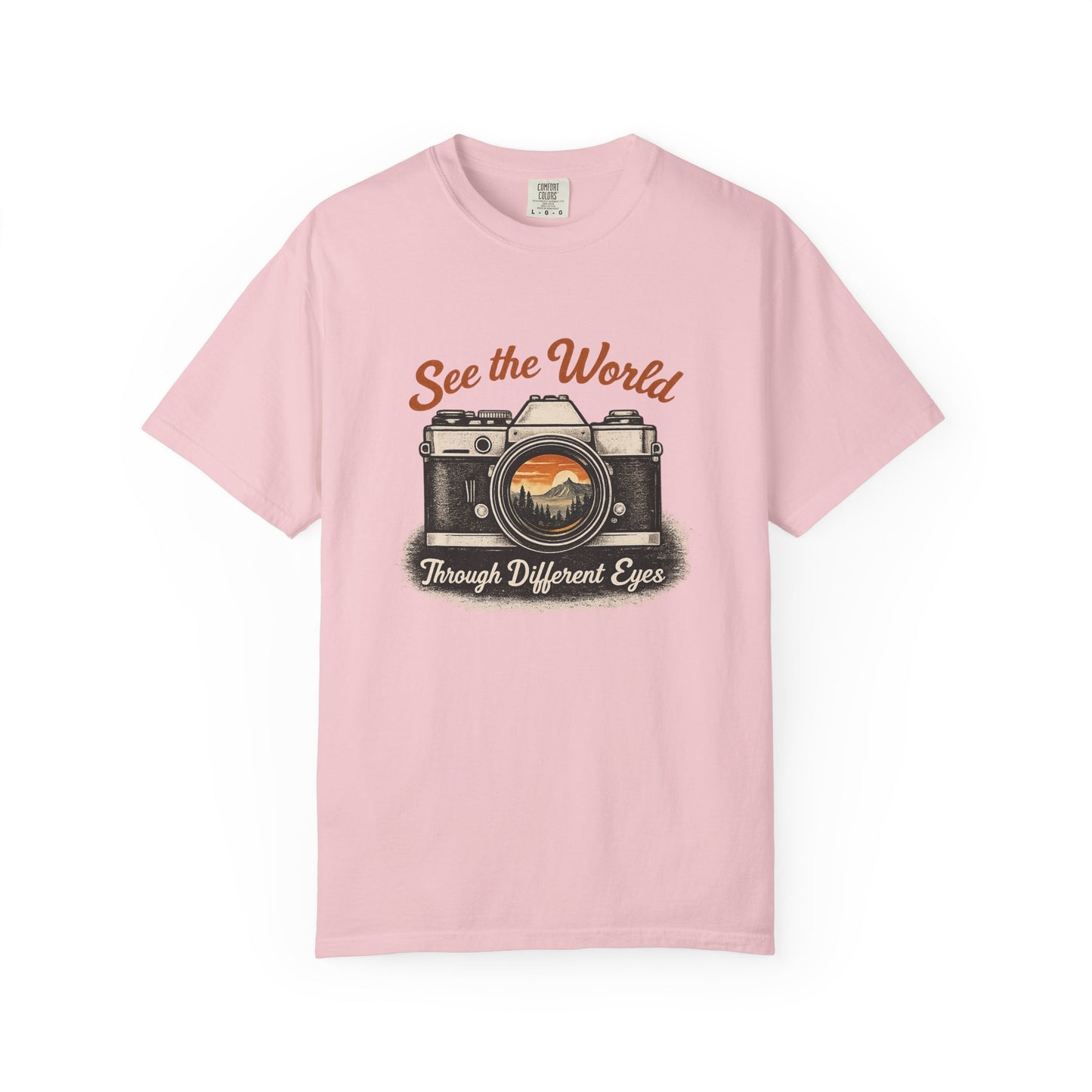 Pink t-shirt with camera graphic and text on a white background