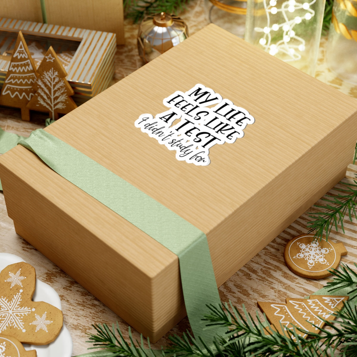Wooden gift box with decorative snowflakes on a festive background with gingerbread cookies.