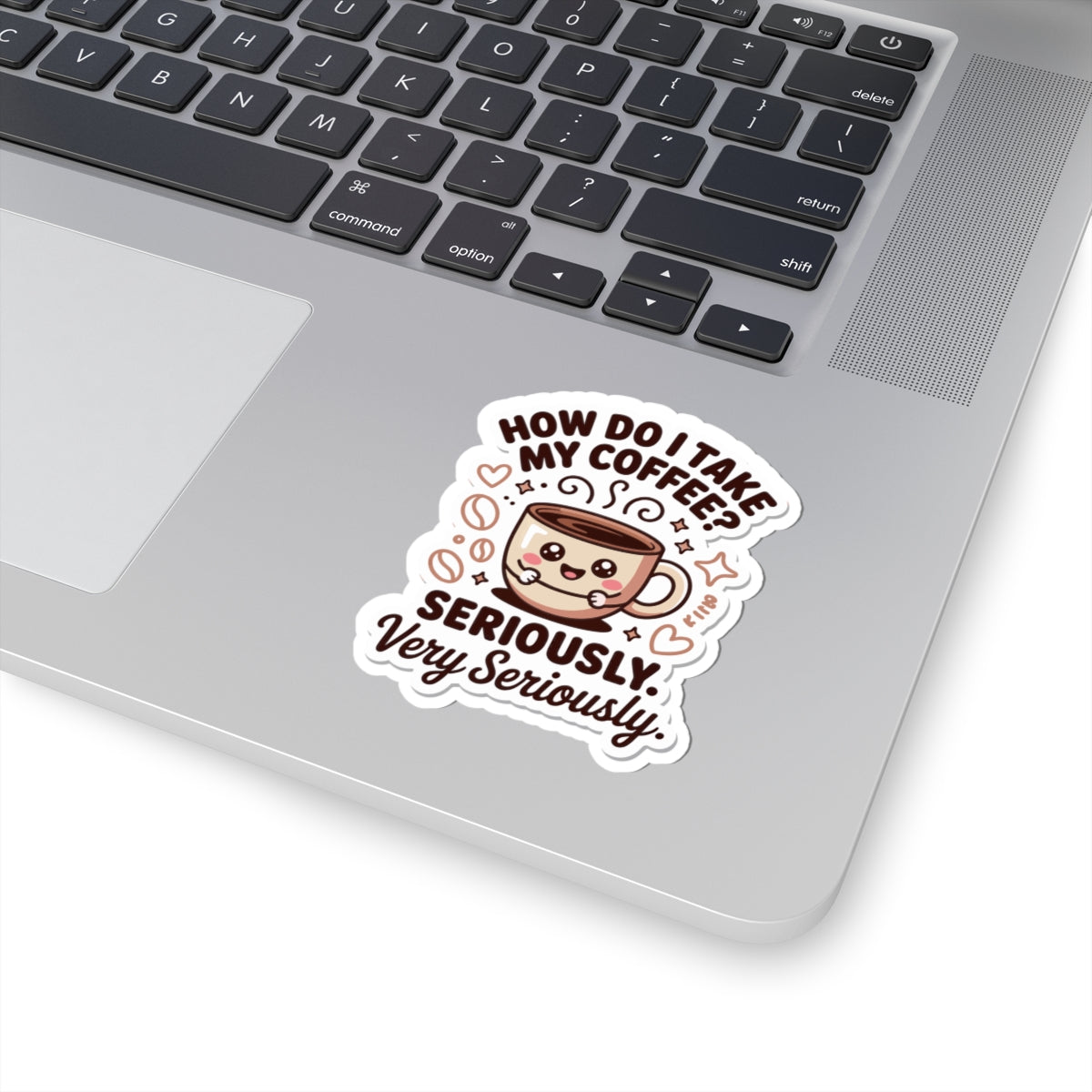 Laptop with a sticker asking 'How do I take my coffee? Seriously, very seriously?'