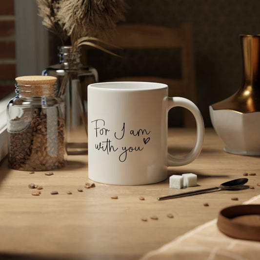 White mug with 'IMUST' text on a wooden table with coffee beans and a jar.