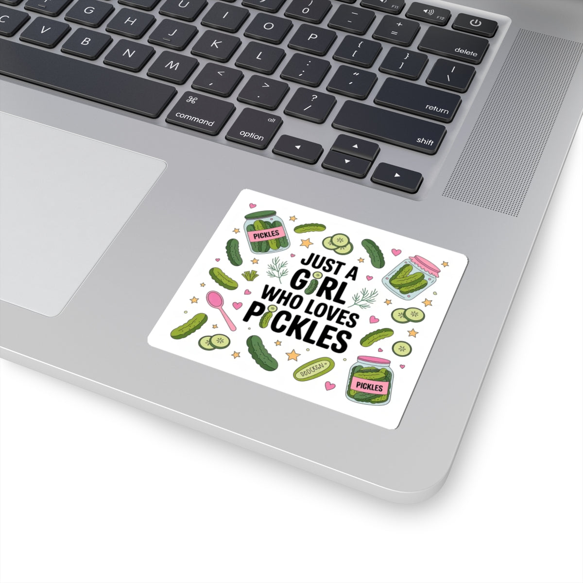Sticker with pickle design and text on a laptop