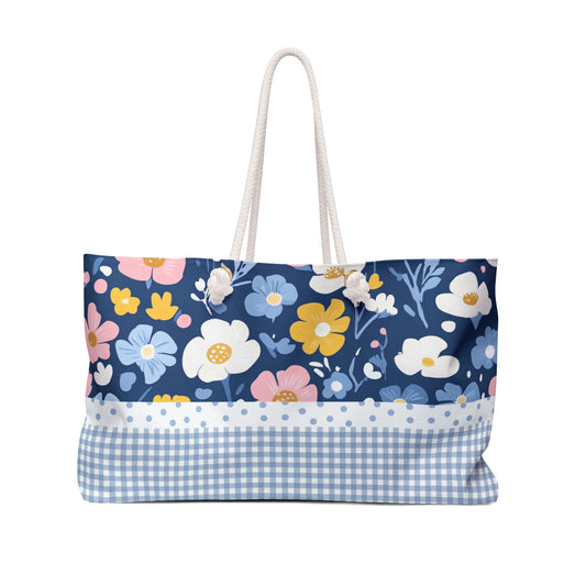 Floral patterned tote bag with a blue checkered bottom section on a white background